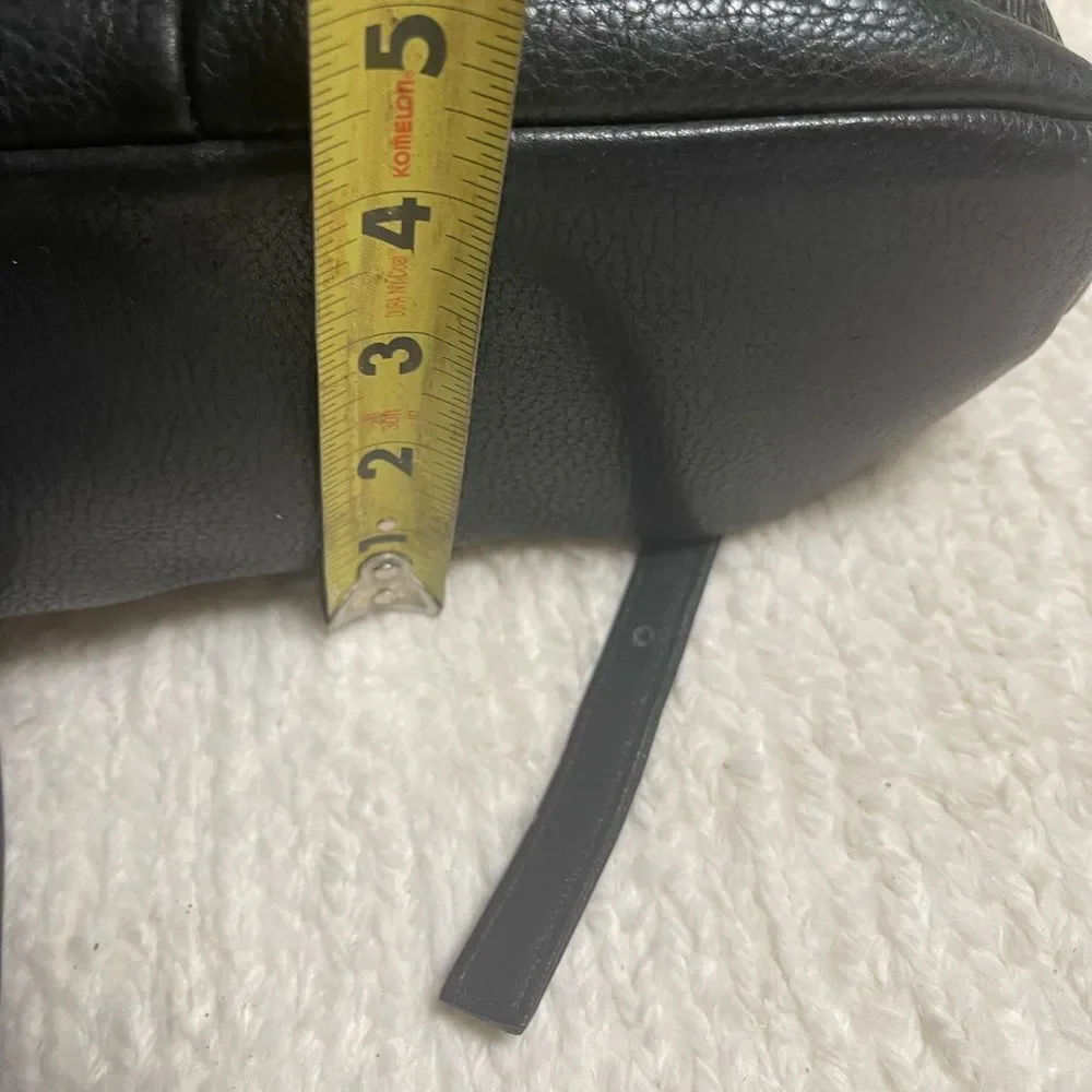 Tignanello Leather Black small Backpack string straps closure.